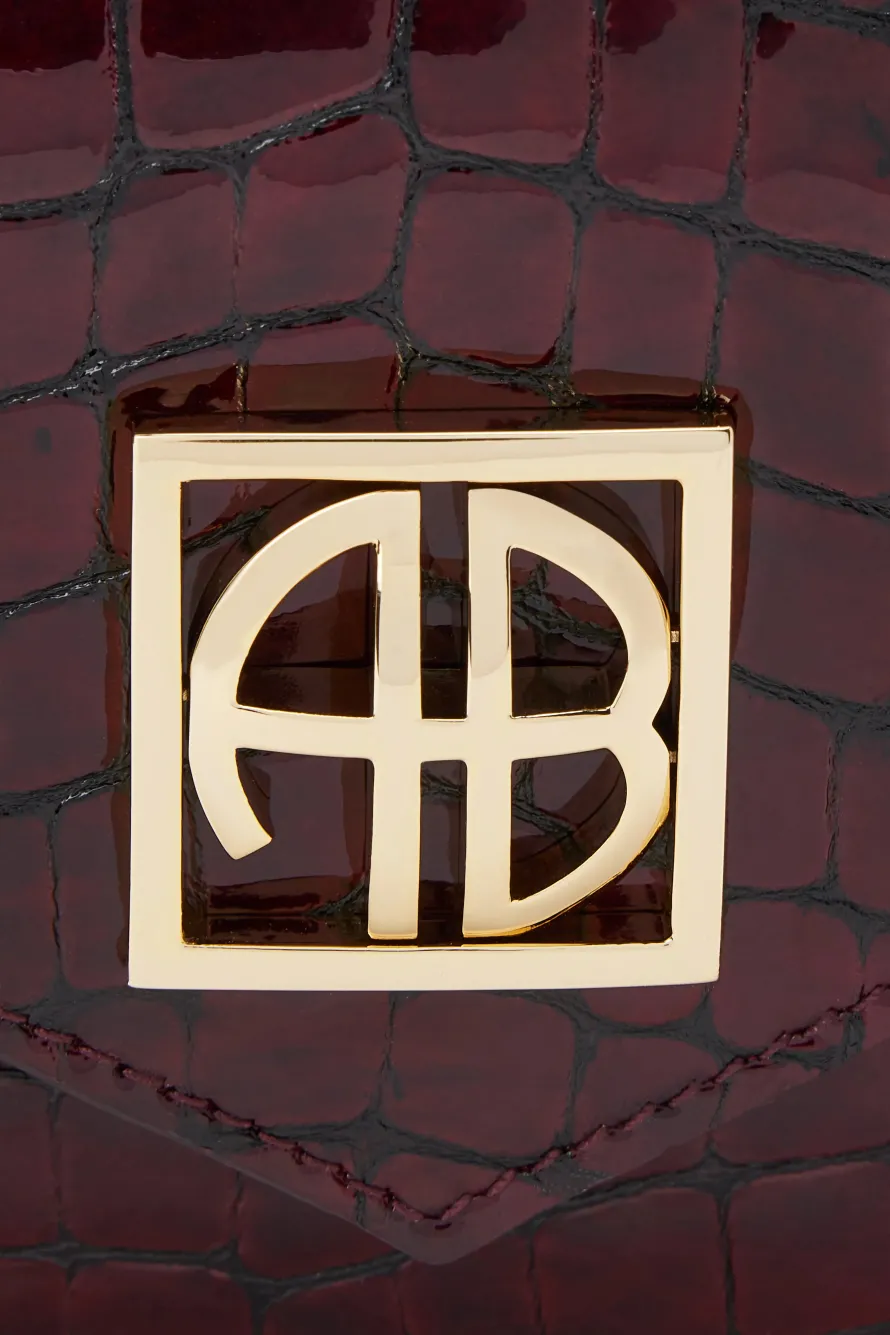Elly Logo Embossed Mini Clutch Bag in Burgundy
